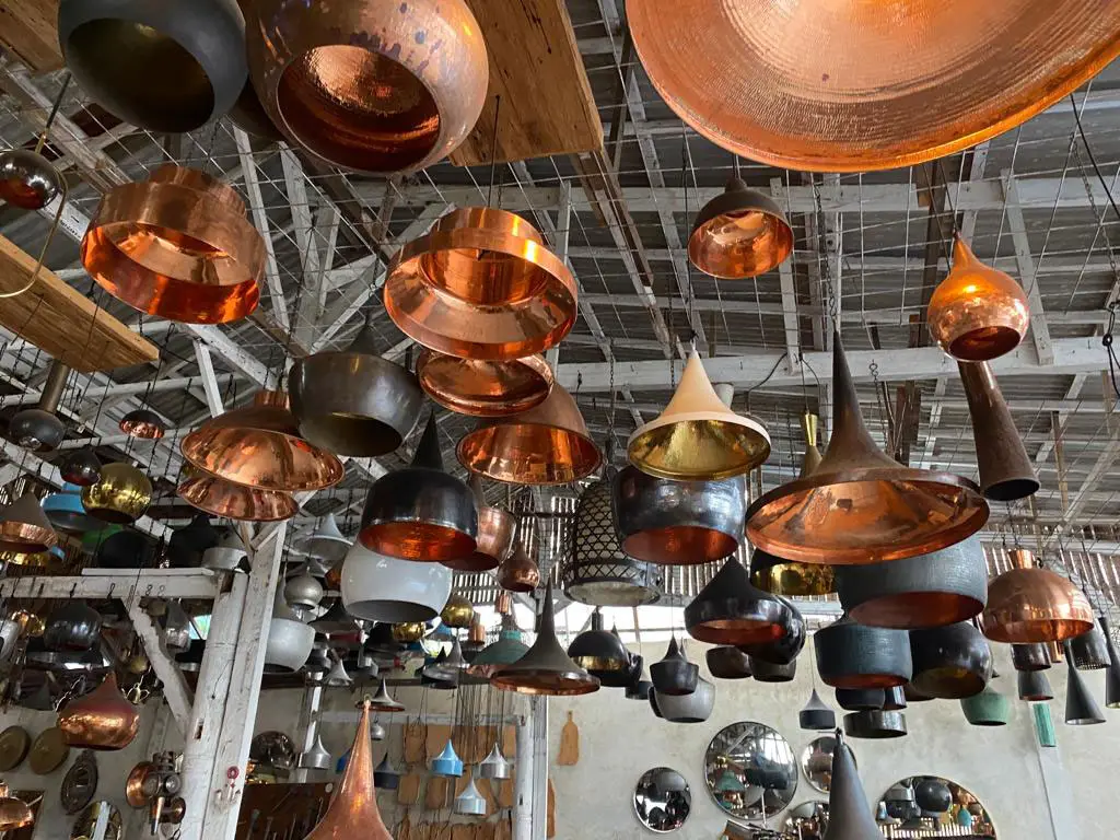 Copper light fittings at a craftsman's workshop, décor sourcing for Esterel Caravaning