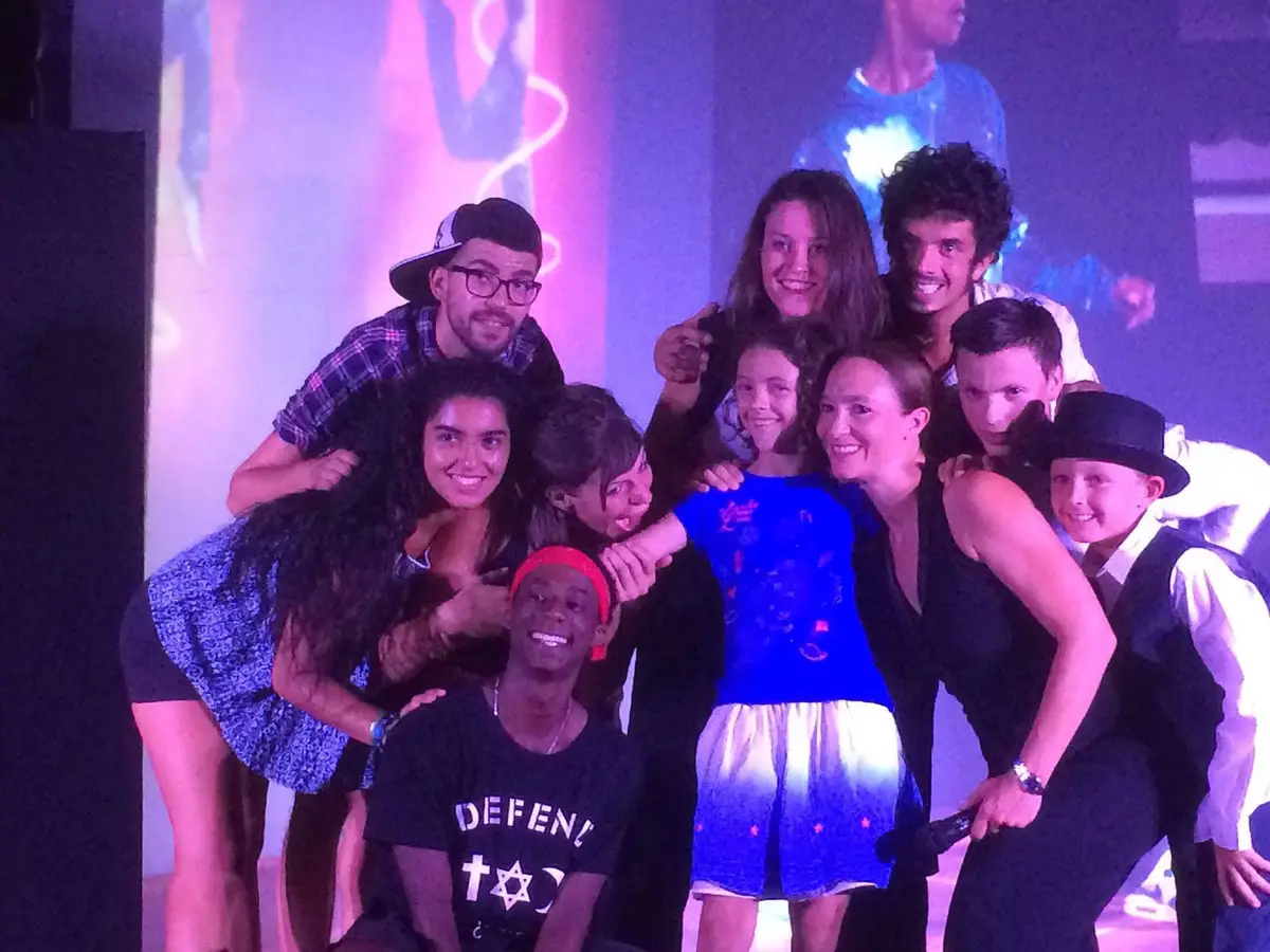 The Esterel Caravaning entertainment team on stage with the campsite children