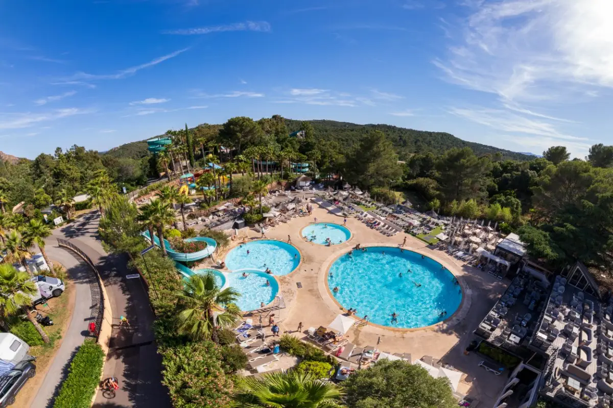Aerial view of the Esterel Caravaning water park, its pools, slides and palm trees